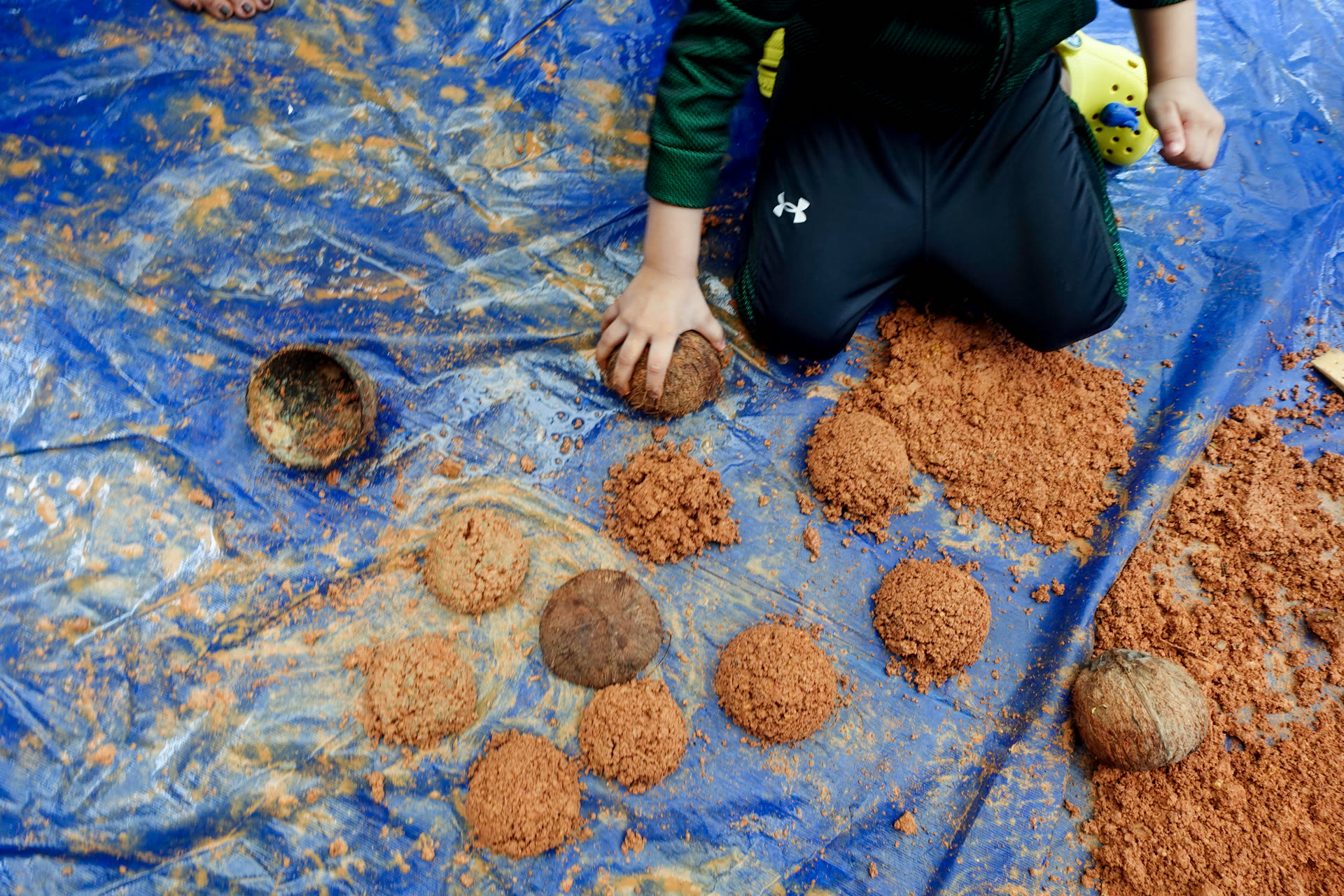 A GEMS learner exploring hands-on activities